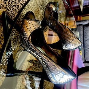 Silver and black dress shoes